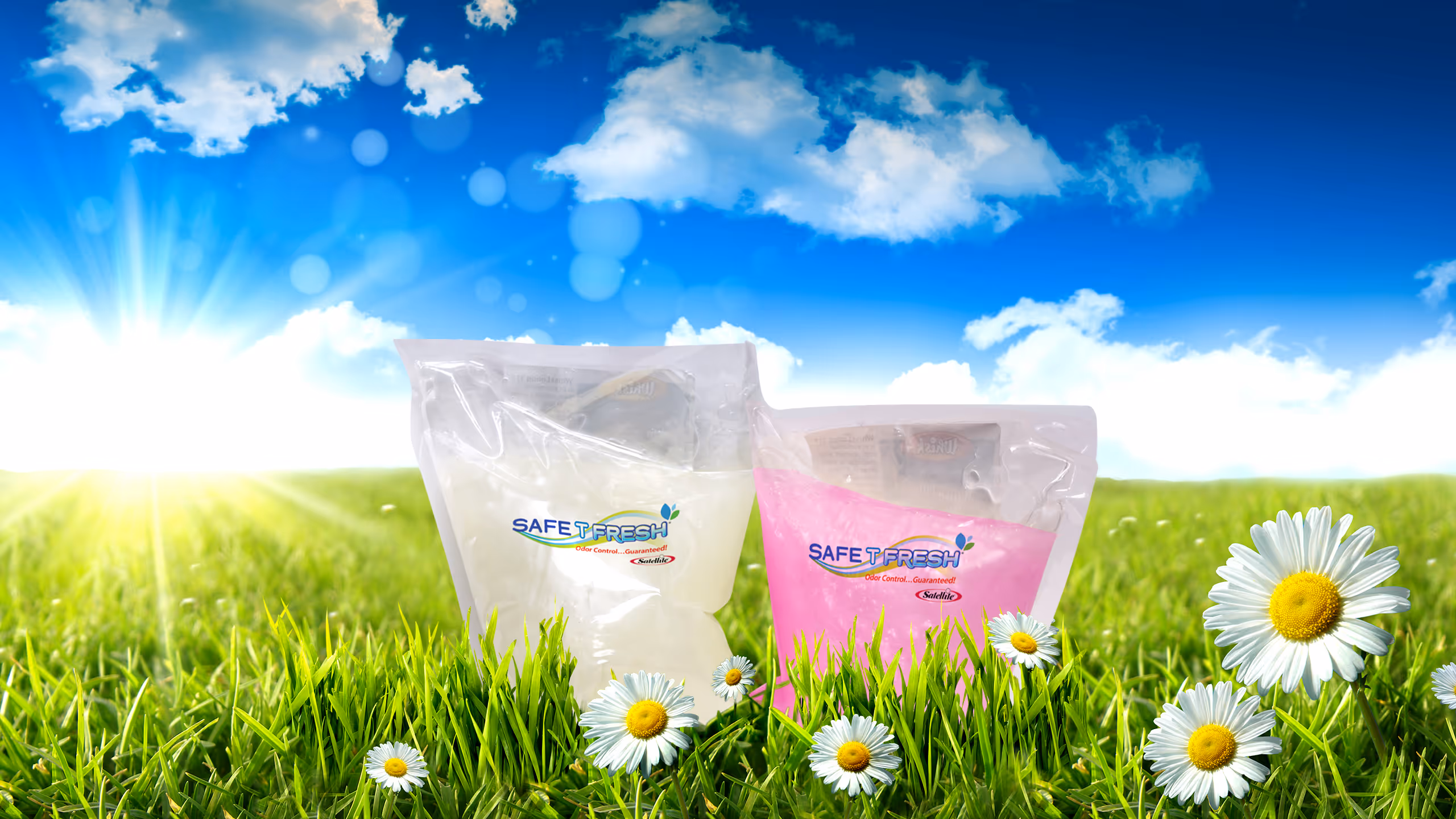 Two Safe T Fresh deodorizer pouches, white and pink, set in green grass with daisies under a blue sky.