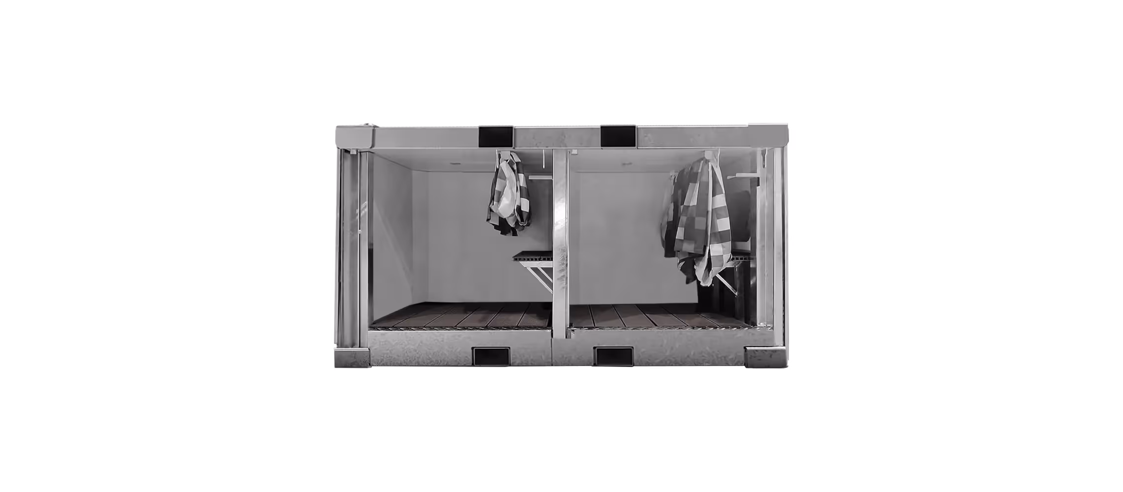 Sanitrax Shower Module featuring two separate enclosed shower spaces. Each space has towels hanging.