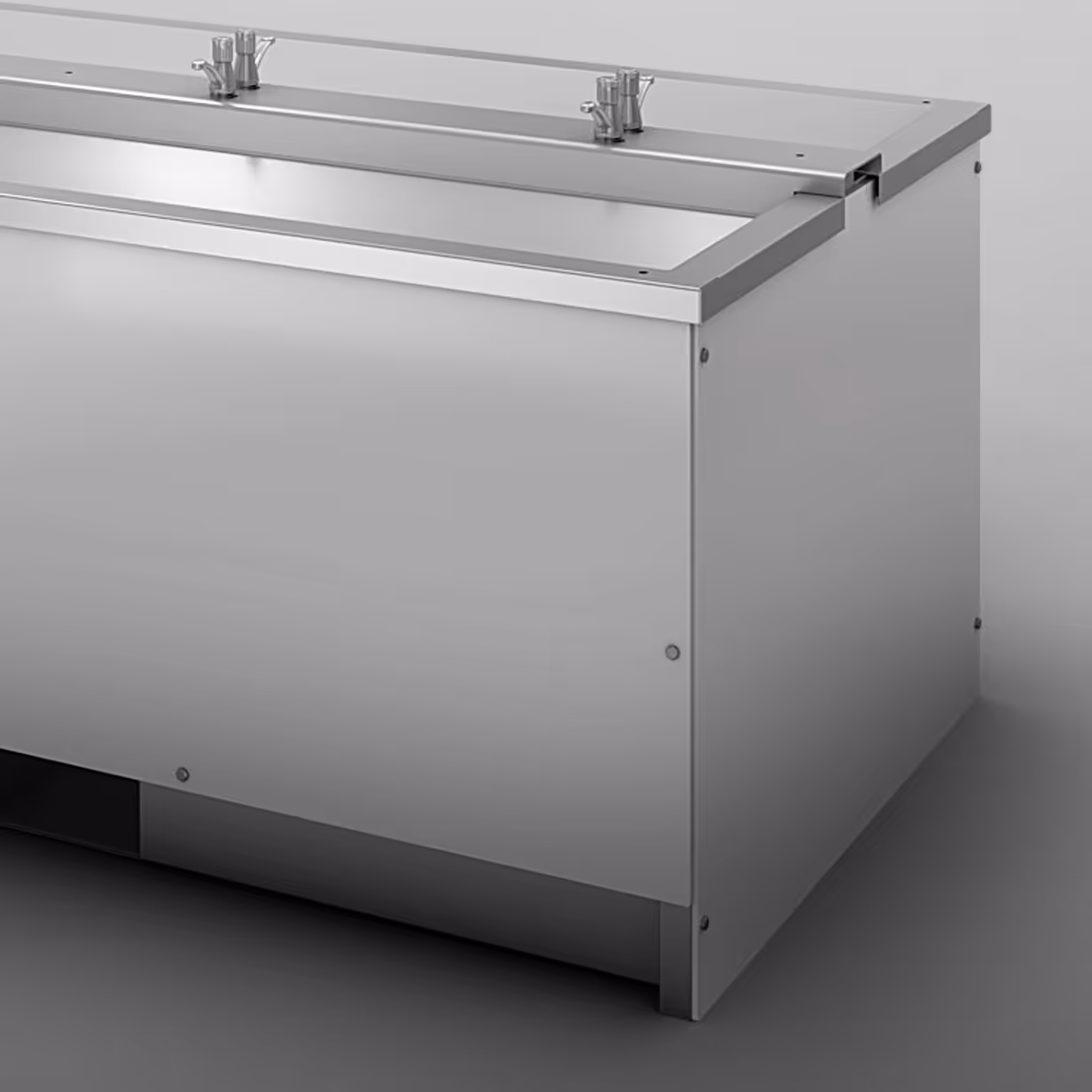 Stainless steel commercial sink with two faucets and a sturdy rectangular basin.