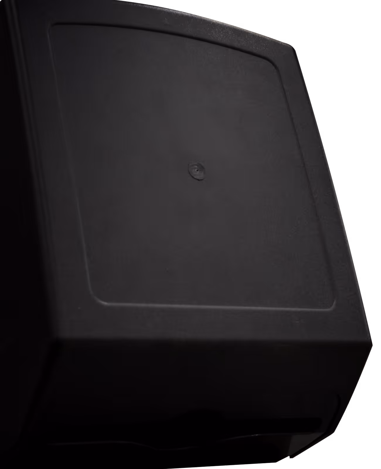 Close-up of a black rectangular dispenser with a textured lid and a front opening slot.