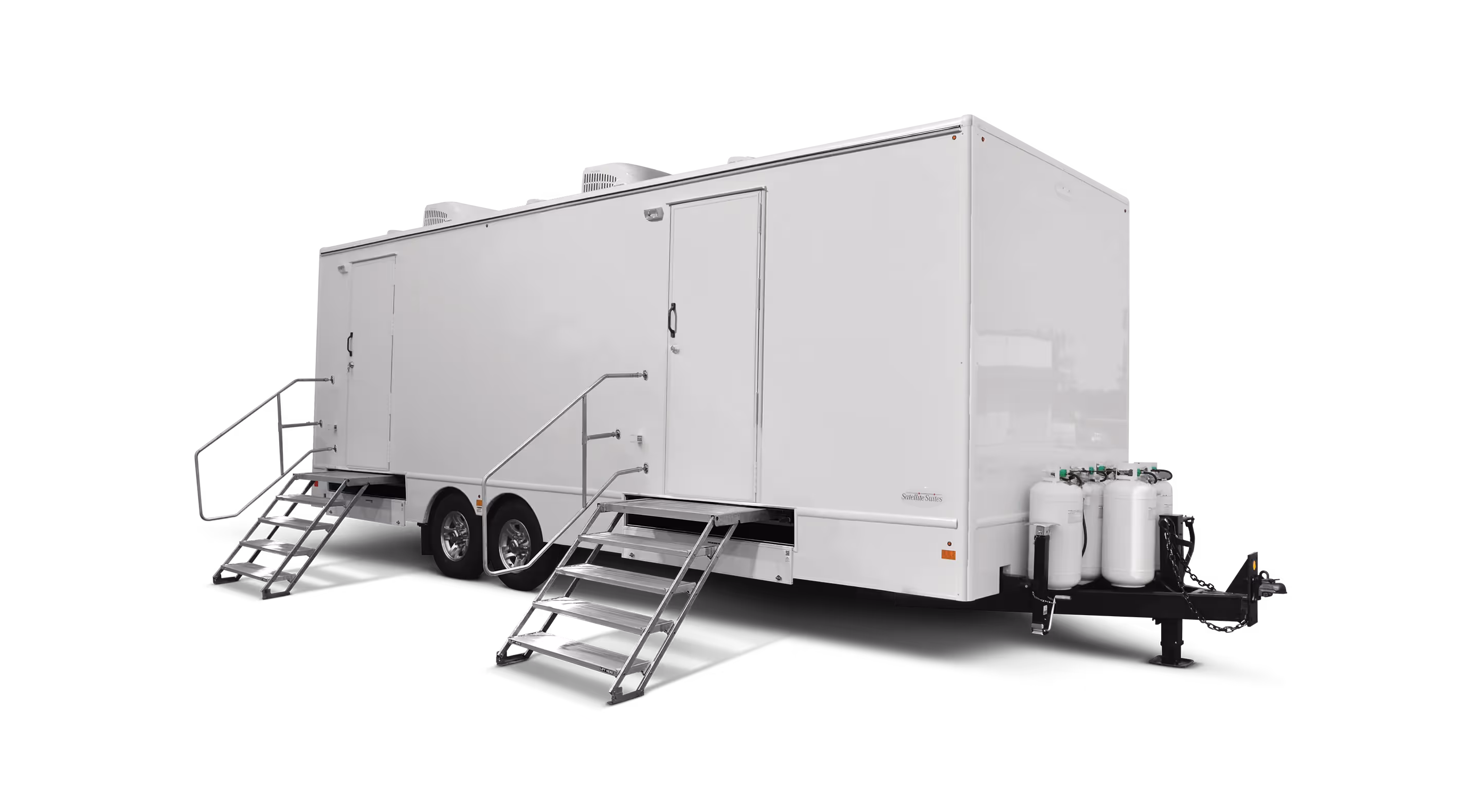 White laundry trailer with two sets of stairs, featuring eight stations and equipment on the side.