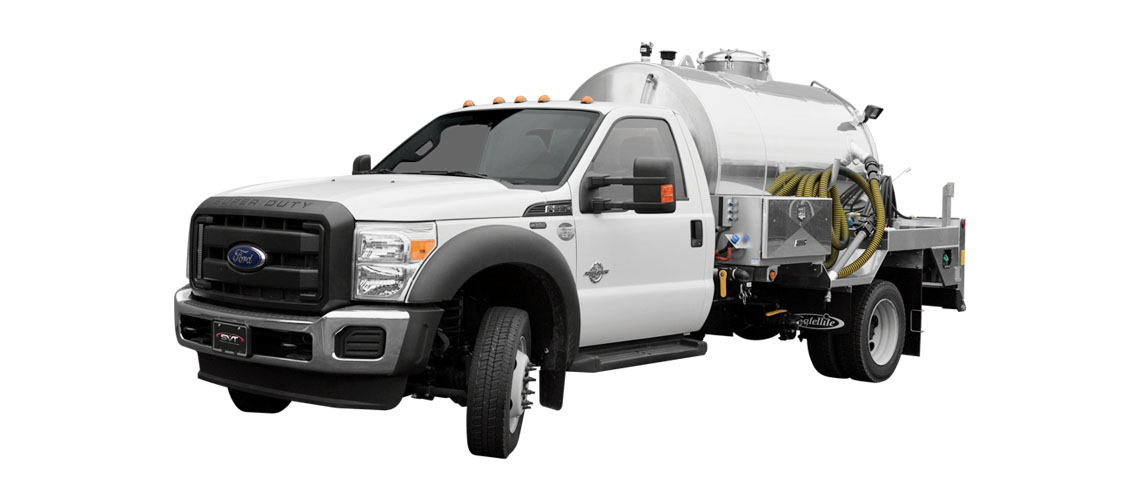 White Ford truck with a tank and equipment for liquid transport mounted in the back.
