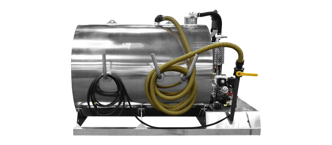 Side view of a large stainless steel industrial tank with attached hoses and pipes on a metal base.