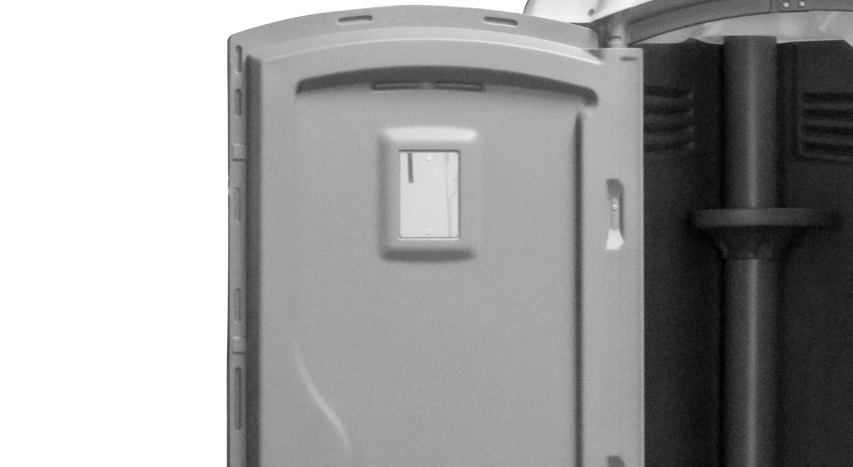 Interior view of a portable toilet door with a small vent window and locking mechanism.