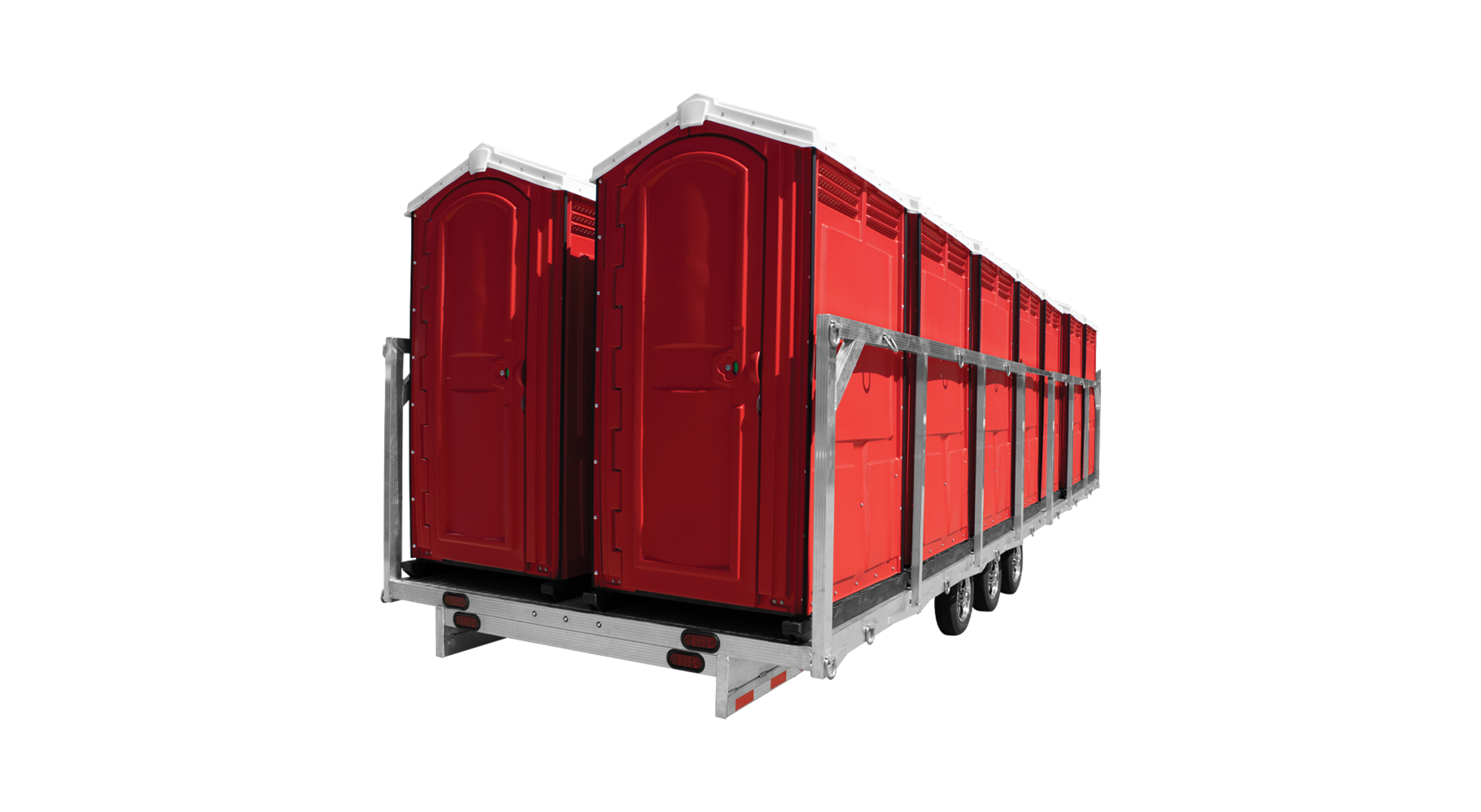 Red portable toilets mounted on a triple-axle trailer frame for transport.