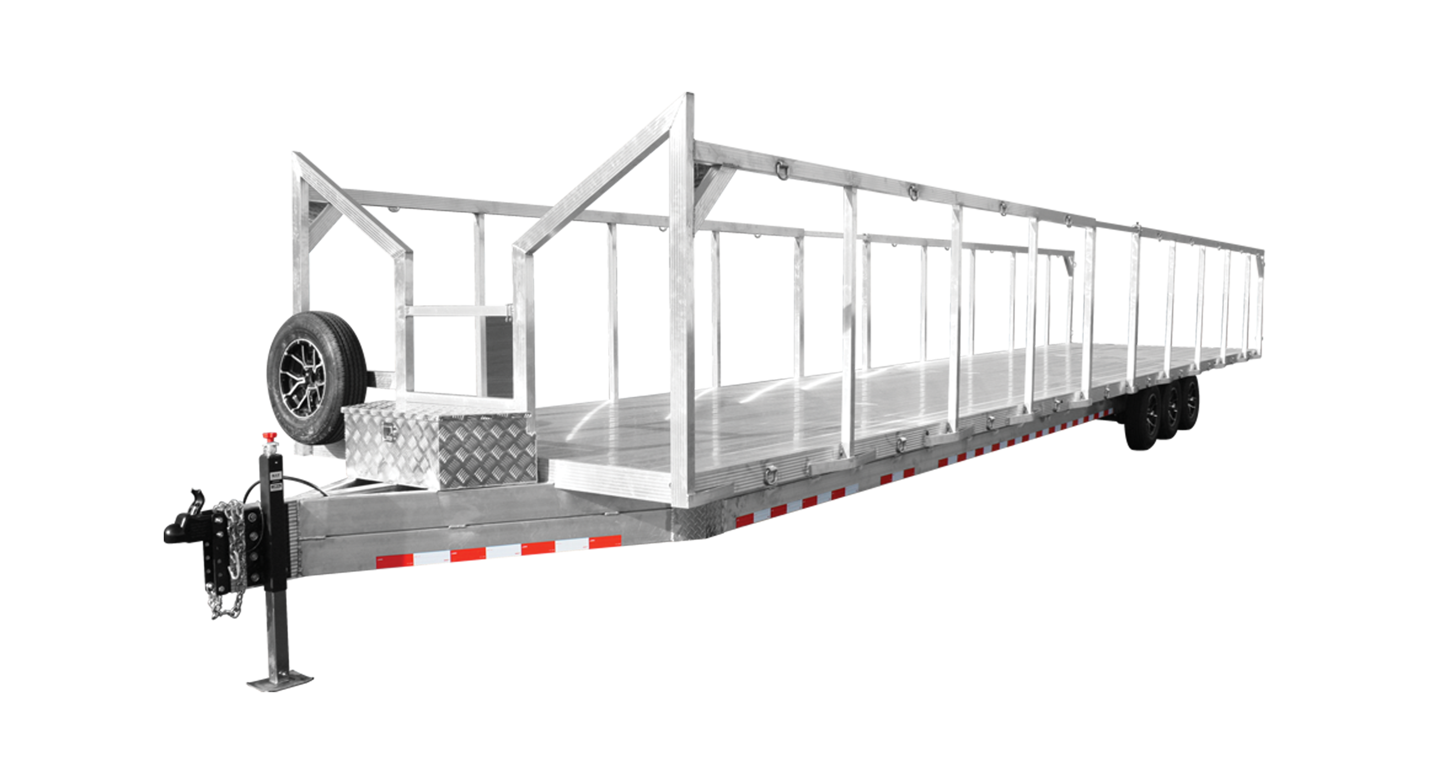 A long flatbed trailer with a metal frame, open sides, and two axles for hauling cargo.