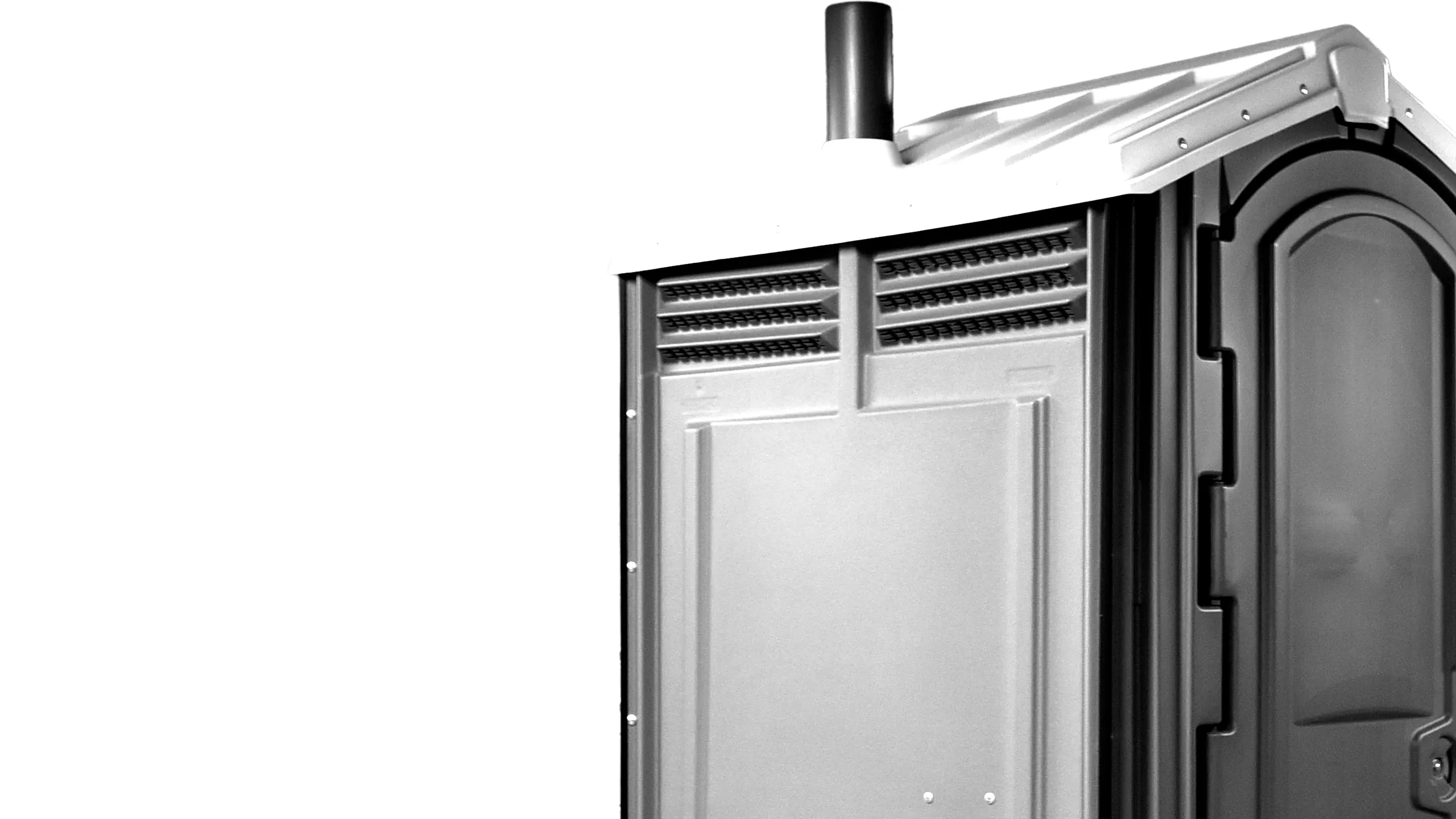 Close-up of a portable outdoor toilet with ventilation pipe on roof against white background.