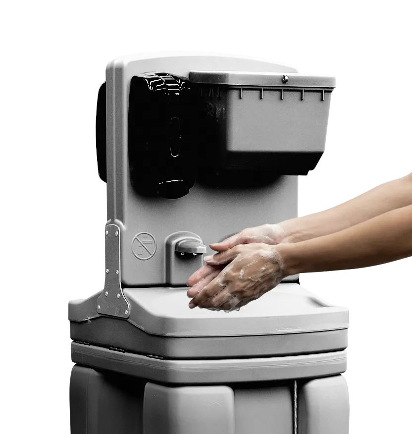 Hands washing with soap at a portable handwashing station with soap and water dispenser.