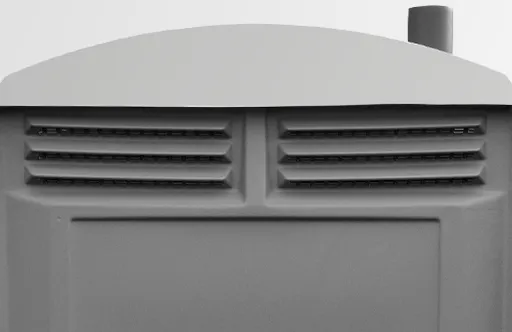 Close-up of gray plastic vents on a surface, part of a larger object with a chimney-like tube.