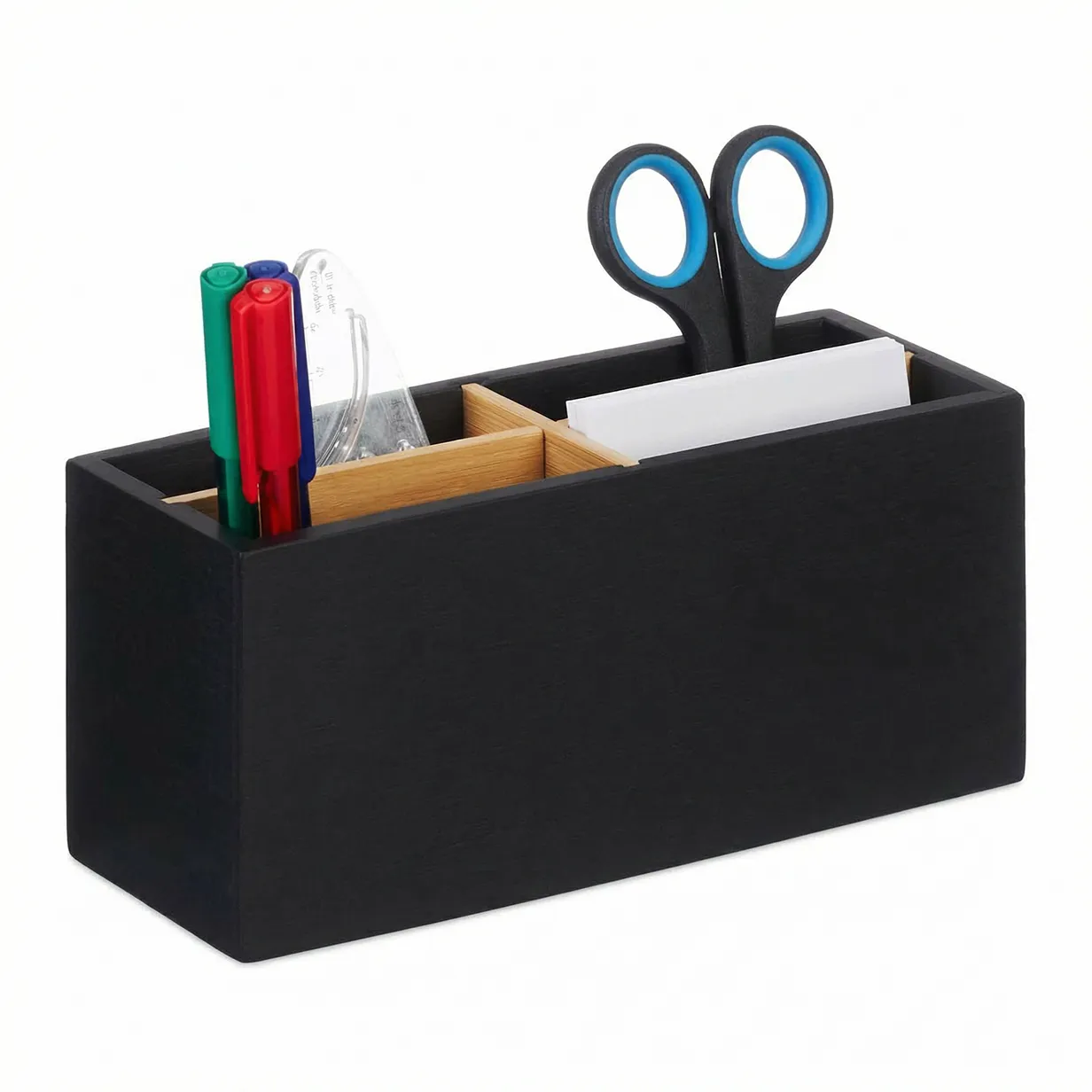 Black desk organizer with compartments holding scissors, pens, and small office supplies.