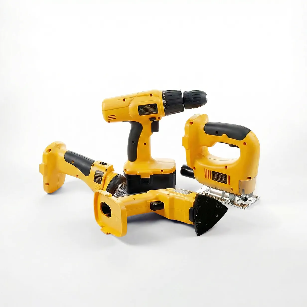 Four yellow cordless power tools on white, including drill and jigsaw.