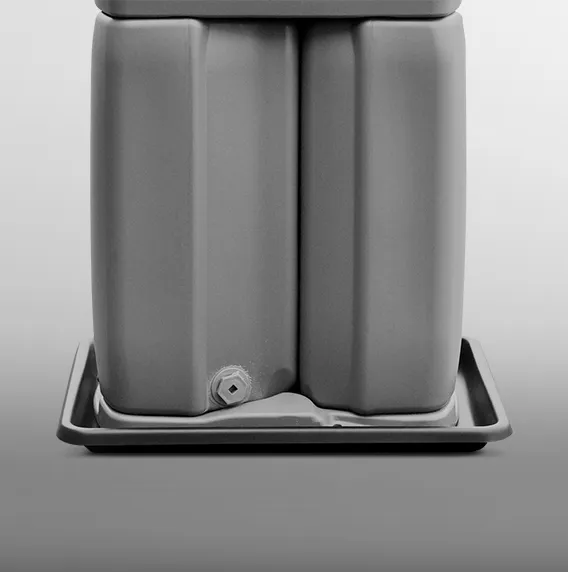 Two plastic containers side by side on a tray, one with a spout at the bottom left corner.