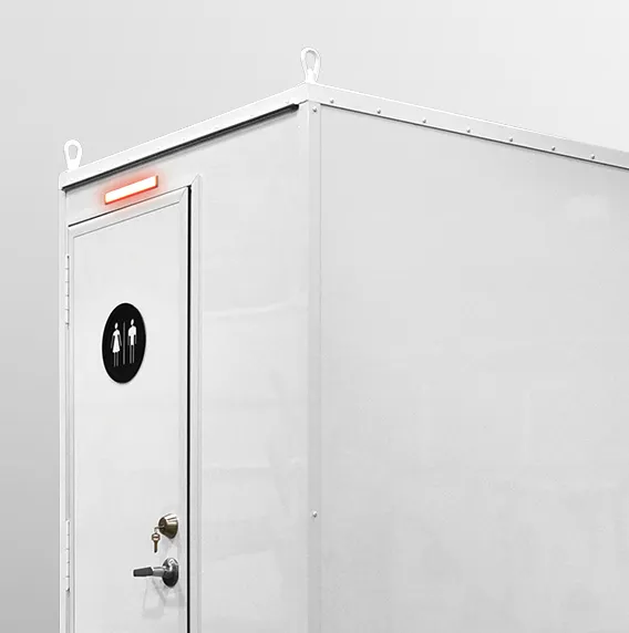 White portable restroom with unisex sign and a red light above the door.