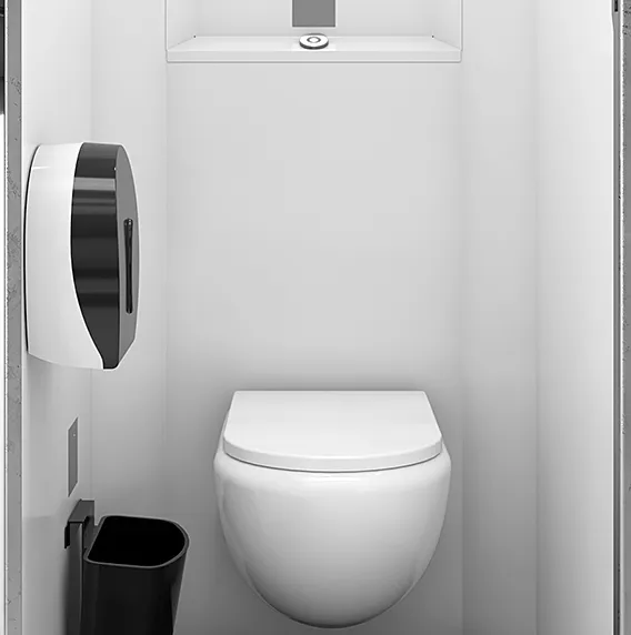 Compact white toilet inside a small stall with a black trash bin and wall-mounted paper dispenser.