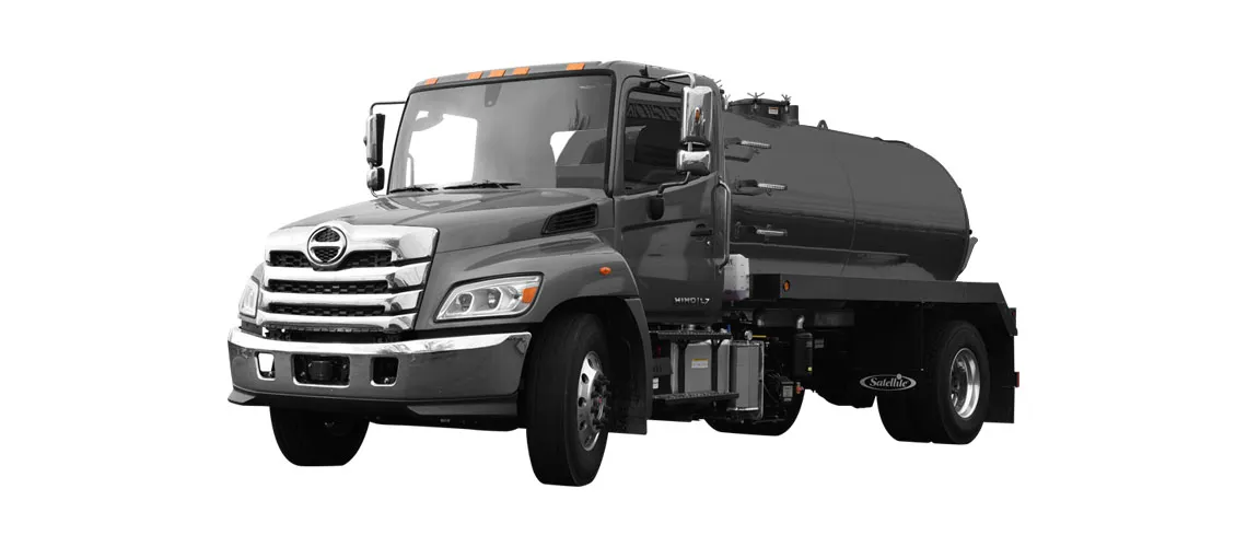 Gray MD 2200 truck with a cylindrical fuel tank mounted on the back.