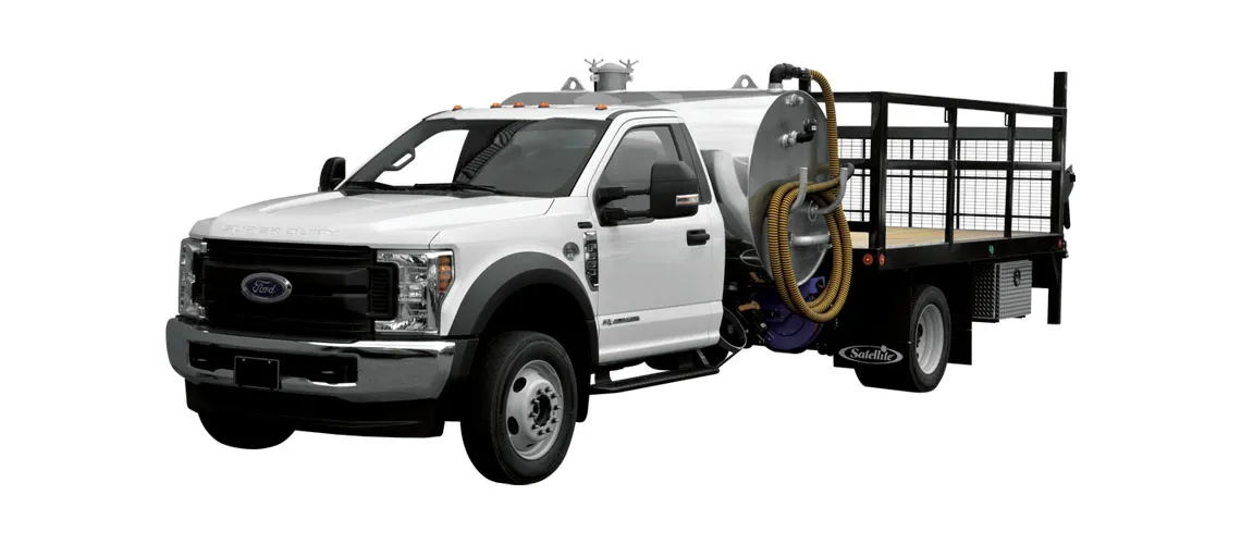 White Ford F-350 truck with a vacuum unit and flatbed, designed for pumping and delivery.